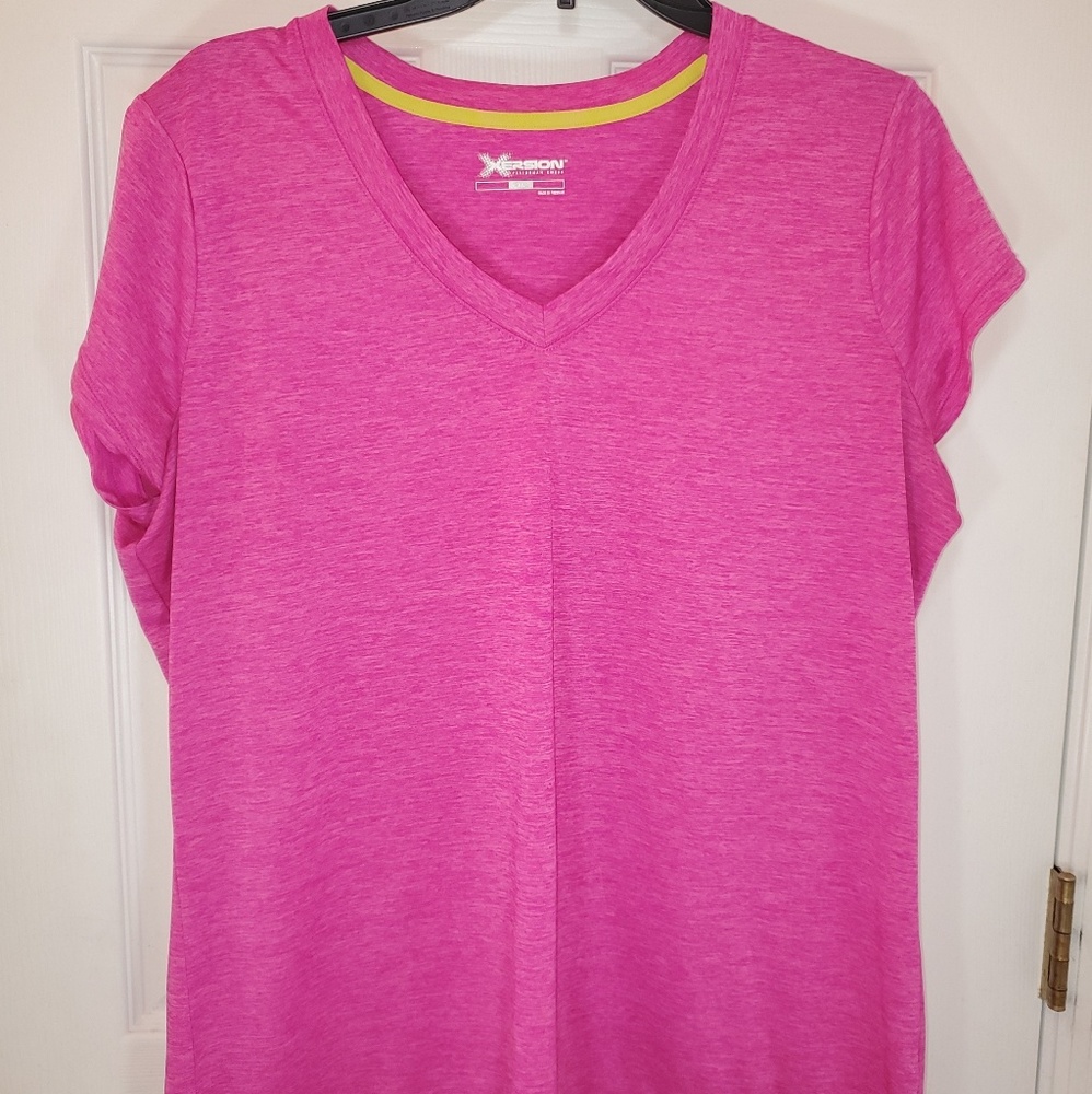 A pink xersion work out shirt